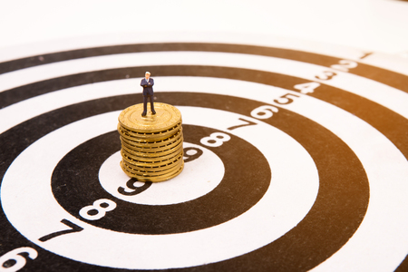 business miniature people  standing on dartboard and gold coin,business conceptの写真素材