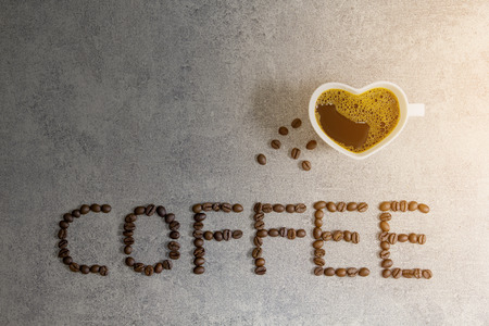 coffee bean text and heart shape coffee cup,top viewの写真素材
