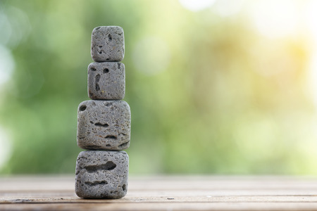 cube rock with nature bokeh backgroundの写真素材