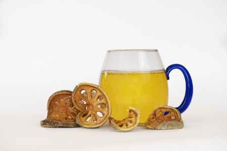 Dry beal and beal juice on white backgroundの写真素材