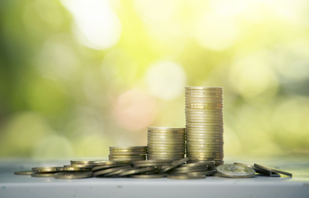 Gold coin with nature backgroundの写真素材