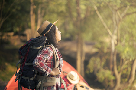 Backpacker woman in camping areaの写真素材
