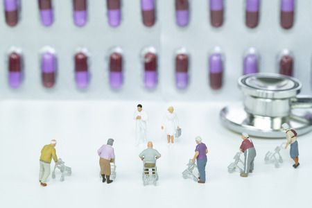 Miniature ederly group with health team,medical conceptの写真素材