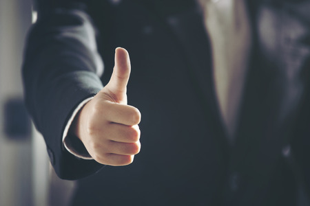Businessman showing thumbs up,business conceptの写真素材