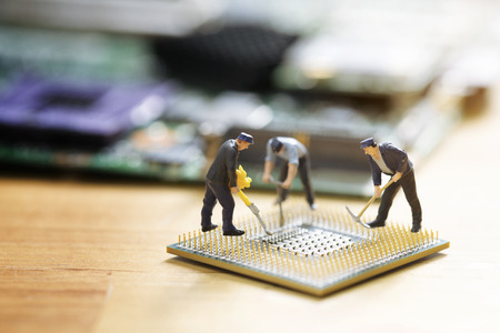 miniature people repair cpu board,teamwork and technology 