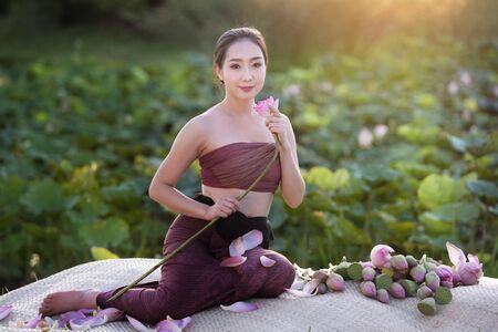 Beautiful woman with lotus flower,spa conceptの写真素材