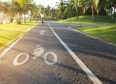 cyclist riding bicycle on bike land in park