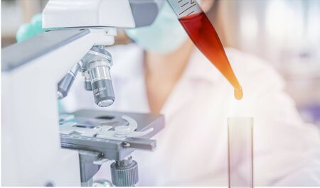 scientist with microscope in laboratoryr ,medicine research concept