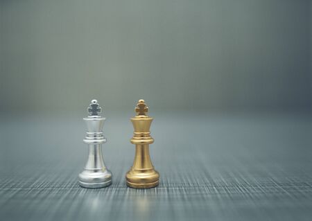 Close up chess pieces on dark background