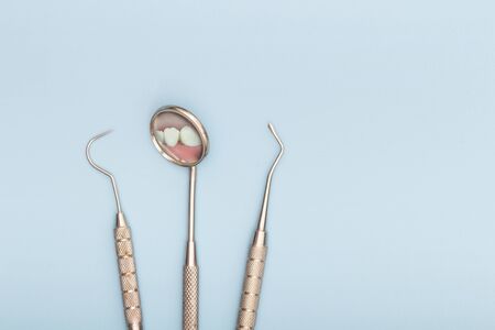 Dental tool in dental office, mirror and hook. Dental care concept