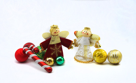 boy ans girl angel doll with golden ballの写真素材