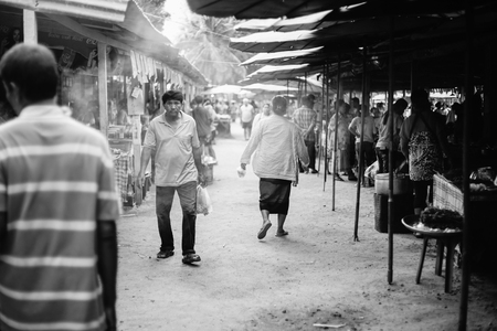 Prachuapkhirikhan,Thailand -april 24, 2016: Unidentified people at thai traditional market Prachuapkhirikhan Province, Thailand / high contrast black and white picture style, Grain addedのeditorial素材