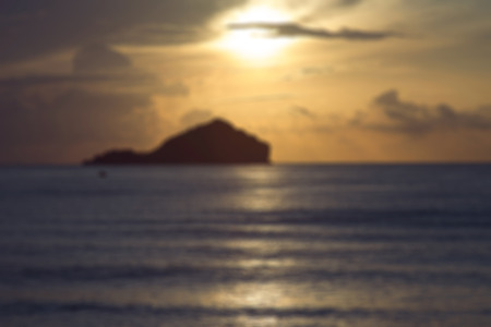 traditional boats are laying on wave surface of the sea with a long big mountain, beautiful sunrise or sunset and cloud , filtered image,Intentionally blurred editing post production.の写真素材