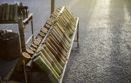 Thai Dessert, glutinous rice roasted in bamboo joints, sticky rice soaked in coconut milk and baked in a length of bamboo, name Khaolam,selective focusの写真素材