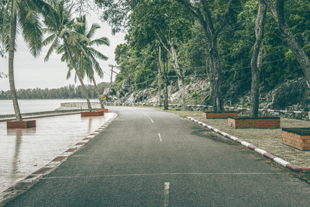 view of beautiful turning road near the sea and mountain,abstract vintage filtered imageの写真素材