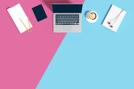 3d rendering : illustration of Top view work space equipment at color background with copy space. notebook tablet pencil paper rolled and coffee cup. pastel tone color.の写真素材