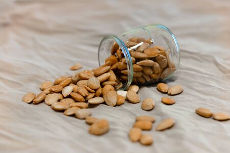 Bowl of toasted almonds on a gray backgroundの写真素材