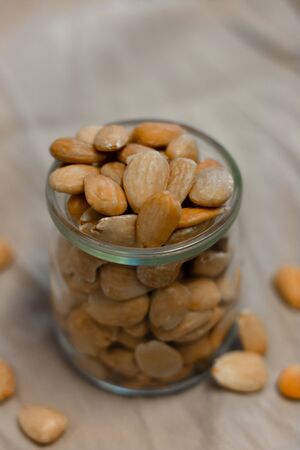 Bowl of toasted almonds on a gray backgroundの写真素材