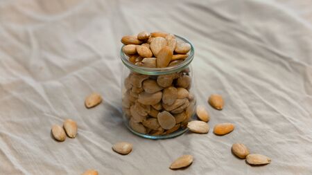 Bowl of toasted almonds on a gray backgroundの写真素材