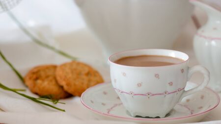 coffee with cookies on the tableの写真素材