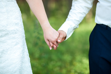 closeup, hands of bride and groomの写真素材