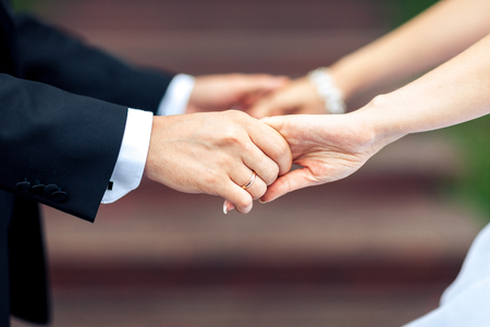 closeup, hands of bride and groomの写真素材