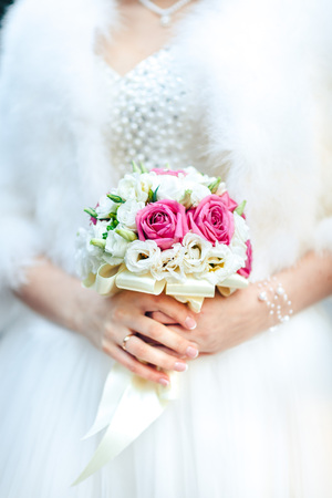 Bride holding beautiful wedding flowers bouquetの写真素材