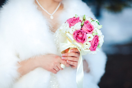 Bride holding beautiful wedding flowers bouquetの写真素材