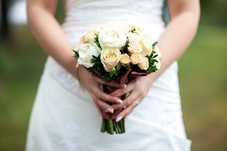 Bride holding beautiful wedding flowers bouquetの写真素材