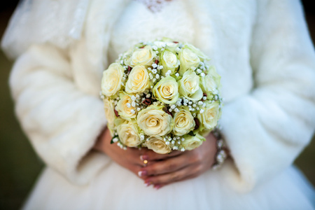 Bride holding beautiful wedding flowers bouquetの写真素材