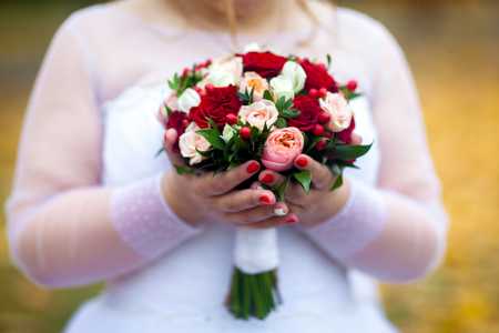 Bride holding beautiful wedding flowers bouquetの写真素材