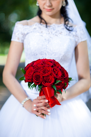 Bride holding beautiful wedding flowers bouquetの写真素材