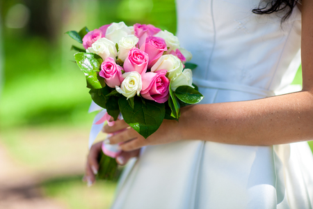 Bride holding beautiful wedding flowers bouquetの写真素材