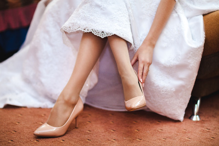 Wedding shoes on the bride's legの写真素材