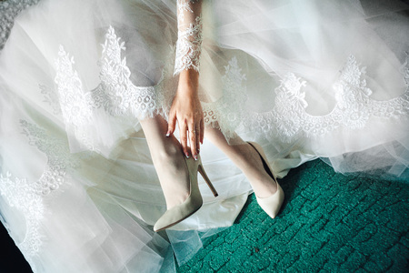 Wedding shoes on the bride's legの写真素材