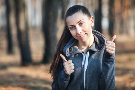 Happy young woman in the forestの写真素材