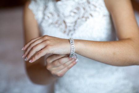 bride hand on white dress,ready for marriage ceremony