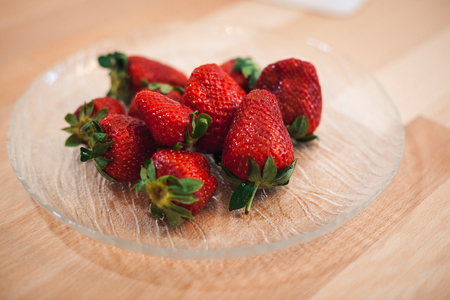 strawberries on the plate ready for use ingredient. Closeup shot of fresh strawberriesの写真素材
