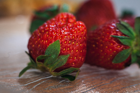 Ripe strawberry with green leaves, close-upの写真素材