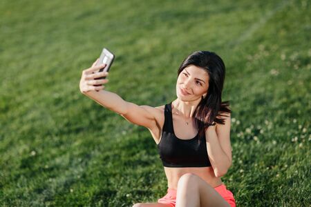 Fitness girl doing a selfie.の写真素材