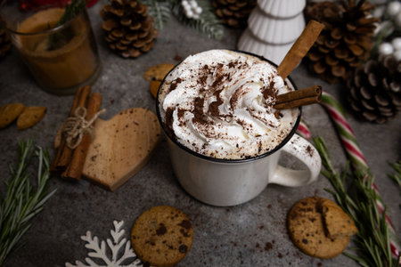 Hot chocolate garnished with whipped cream and cinnamon, christmas decoration