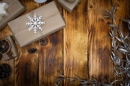 Christmas gift box on rustic wooden background. Top view with copy space