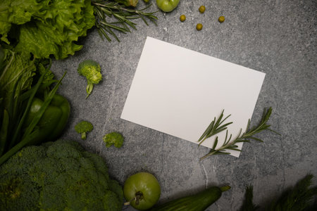 A background of green vegetables with a card message, promoting healthy eating and natural food choices.の写真素材