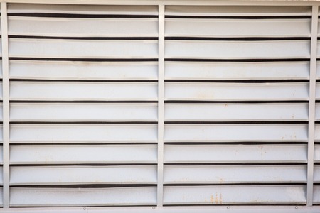 big old and damaged metal shutters with rust appearingの写真素材