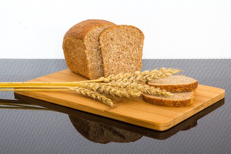 fresh bread on a wooden Board only the ripened wheatの写真素材