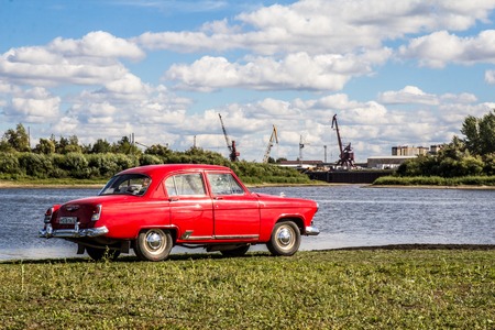 vintage transport retro car on a background of the river and the autumn skyのeditorial素材