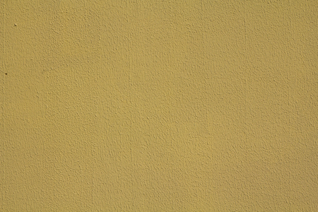 rough textured yellow wall color for background or web designの写真素材