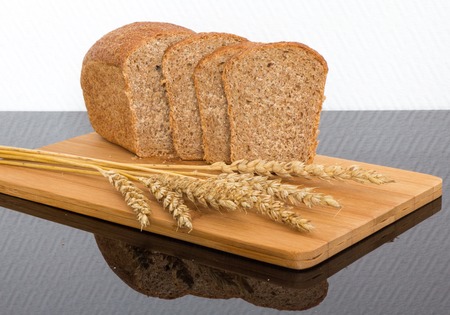 fresh bread on a wooden Board only the ripened wheatの写真素材
