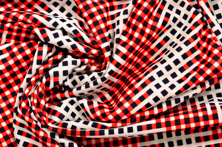 Red, white and blue checked print as background.の写真素材