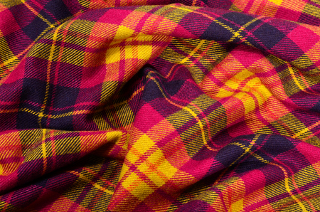 Colored lines and square pattern. Scottish checked fabric crumpled.の写真素材